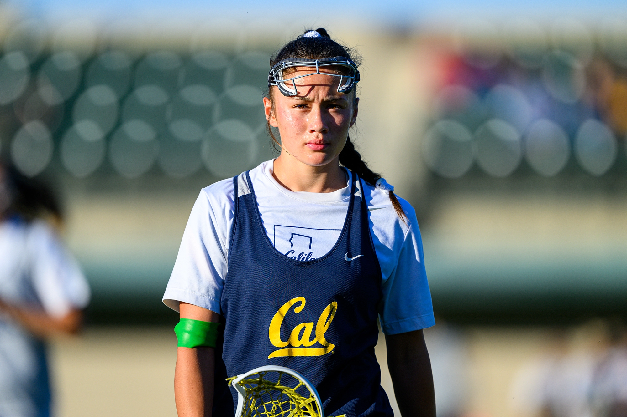Young female soccer player taking throw in